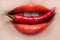 Woman lips and chili pepper