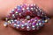 Woman lips with diamond ring. Sensual womens open mouths. Rich and sexy. Close up, macro with beautiful mouths.