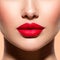 Woman lips with a red lipstick on lips. Closeup female red lips.  Bright makeup