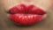 Woman lips with red lipstick making kiss