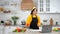 Woman listen tells teacher chef slices tomato on cutting board in home kitchen