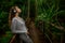 Woman listen to the music in the tropic forest