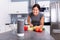 Woman Listening Music On Wireless Speaker