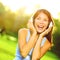 Woman listening to music in headphones in park