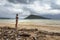 Woman on the littered beach in cambodia