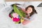 Woman Loading Clothes In Washer