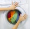 Woman loading washing machine