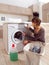 Woman loading the washing machine