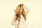 Woman with long curly hair use curling iron. Heat setting for hair type. Girl adorable blonde hold curling iron white