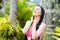 woman with long hair in bikini under the shower on tropical beach