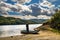 Woman with long hair on the boat by Vrutci lake on Zlatibor