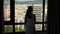 Woman looking on aerial Barcelona cityscape out of window
