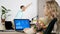 Woman looking at animated financial chart on the computer on the living room