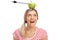 Woman looking at an apple pierced by an arrow