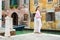 Woman looking back over shoulder smiling, standing near canal