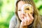 A woman is looking through cake Trdelnik