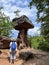 Woman looking at devil table mushroom rock in Hinterweidenthal in Pfalz Forest