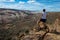 Woman looking down the Halls Creek Overlook Capital Reef National Park