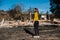 Woman looking at her burned home after fire disaster