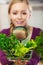 Woman looking magnifier at vegetables