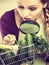 Woman looking magnifier at vegetables