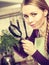 Woman looking magnifier at vegetables