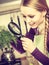 Woman looking magnifier at vegetables