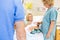 Woman Looking At Nurse While Feeding Milk To