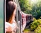 Woman looking out the window of the old train. Bulgarian mountains, Alpine railway in the Balkans