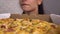 Woman looking at pizza, fast food addiction. Enjoying tasty pizza