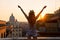 Woman looking on rooftops of rome on sunset