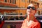 Woman looking on street of Rome in tour bus