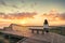 Woman looking at sunset at Hallett Cove boardwalk