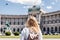 Woman looking to Hofburg complex in Vienna