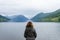 Woman looking towards norwegian fjords