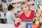 Woman looking at trim in craft shop