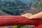 Woman looking at the view of the natural forest at the viewpoint at sunrise in the morning.