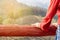 Woman looking at the view of the natural forest at the viewpoint at sunrise in the morning.