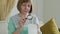 Woman looks at a receipt from a supermarket through a magnifying glass. Cost tracking and budgeting