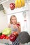 Woman Looks into Refrigerator