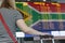 Woman looks at the scoreboard at the airport. Select a country South Africa Republic for travel or migration