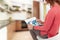 A woman looks into a tablet and watches information for coronavirus.