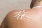 Woman lotion sunscreen sun symbol shoulder beach