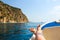 Woman lounging on a catamaran sailboat