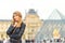 Woman at Louvre in Paris, France. Young tourist girl admiring the views. French style. Portrait soft bokeh backgrounds