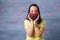 Woman in love holding heart shaped gift box