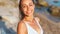 Woman lovely looking at camera with smile and enjoying summer vacation on beach