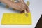 A woman lubricates with a silicone baking dish. Using this brush.