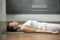 Woman lying in Corpse exercise