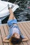 Woman lying on dock